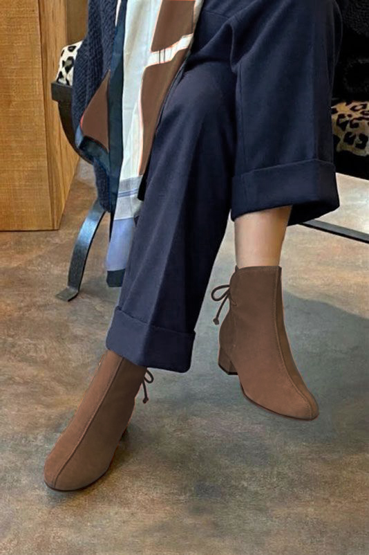 Women's chocolate brown back lace-up ankle boots with round toe and low block heel - Worn view